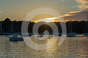 Sailboats at sunset on Aven river in BÃ©nodet, FinistÃ¨re, Brittany France