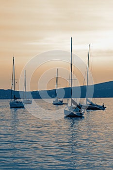 Sailboats on water at sunset. Beautiful Mediterranean landscape. Montenegro, Kotor Bay