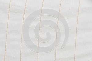 Sailcloth in white texture of woven fabric with beige stitching lines