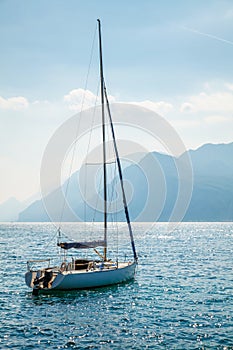 Sailer at water of lake bay photo