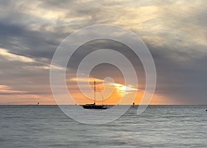 Sailing across Moreton Bay, Australia, at sunset
