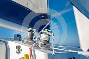 Sailing background concept. Knots and winch and sea closeup view. Sea and ocean sport or recreational design template