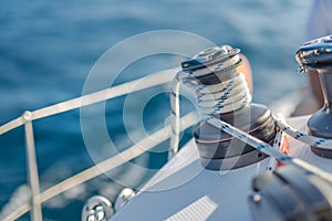 Sailing background concept. Knots and winch and sea closeup view. Sea and ocean sport or recreational design template