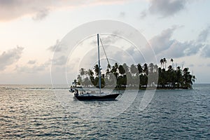 Sailing with beautiful sunset near paradise island, San Blas