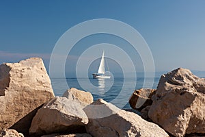 Sailing boat on Adriatic Sea, seen from Piran coast, Slovenia