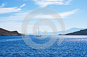 Sailing boat on Aegean sea near Nisyros Island