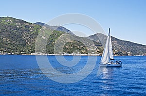 Sailing boat on Aegean sea near Nisyros Island