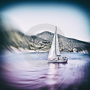 Sailing boat on Aegean sea near Nisyros Island