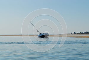 Sailing boat aground.