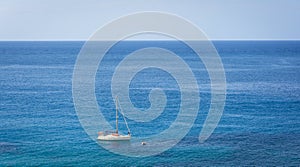 Sailing boat on blue mediterranean water in Ibiza island