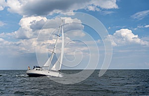 Sailing boat on blue open sea. Concept of Dream, adventure and freedom