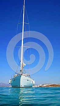 Sailing boat in blue sea