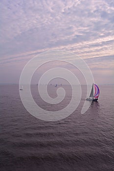 Sailing Boat in the calm sea, the Isle of Wight, England