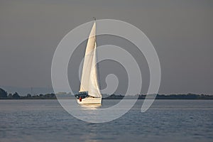 Sailing boat in dusk light