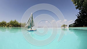Sailing boat floating in a pool