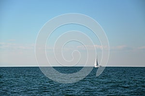 Sailing boat with full sail photo