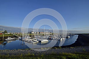 Sailing boat in the harbor in zealand netherlands at sunrises