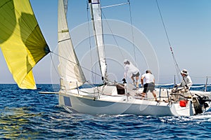 Sailing boat in light wind during regatta competition