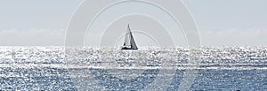 Sailing boat in a Mediterranean sea shining