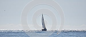 Sailing boat in a Mediterranean sea shining