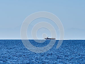 Sailing boat at an open sea, Greece