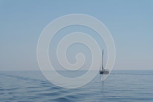 Sailing boat in the open sea of greece