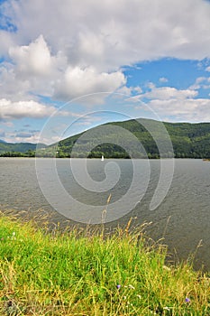 Sailing boat on quiet silent lake