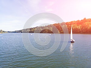 Sailing boat on the river at sunset, yacht