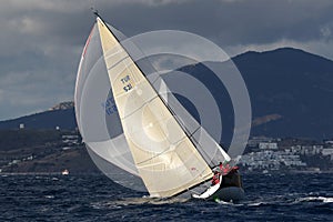 A sailing boat sailing in strong wind and on the rough sea racing in Bodrum, Turkey