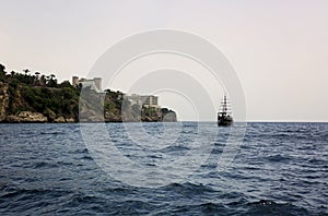 Sailing boat in the sea in the coastline