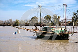 Sailing boat at sea with horizon line in the background photo