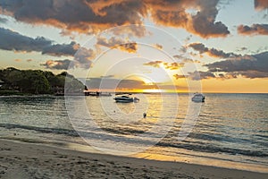 Sailing boat during sunset on the public beach of Albion,Mauritius. photo