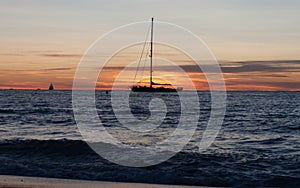 Sailing boat in sunset seascape in Mediterranean sea