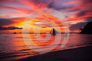 Sailing boat to the sunset in Boracay island on