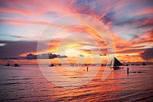 Sailing boat to the sunset in Boracay island on