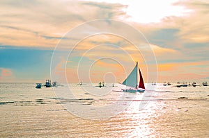 Sailing boat to the sunset in Boracay island