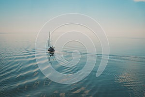 Sailing boat traveling in the open sea