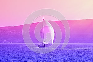 Sailing boat on water, gradient toning. Travel concept