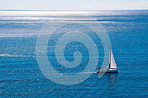 Sailing boat in the wind photo