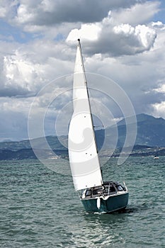 Sailing boat in the wind photo