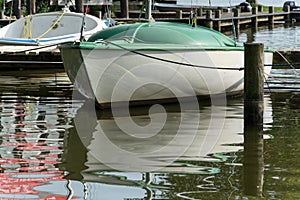 Sailing boat at a wooden pier on a lake