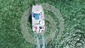 Sailing boat, yacht or catamaran in Caribbean sea water. Dominican Republic