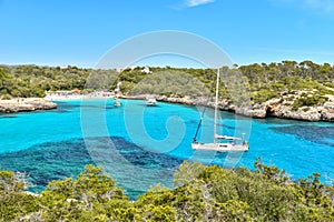 Sailing boats at Cala Mondrago - beautiful beach and coast of Mallorca