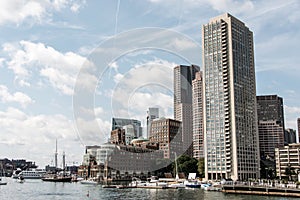 Sailing boats on the Charles River in front of Boston Skyline in Massachusetts USA on a sunny summer day