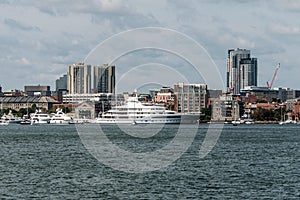 Sailing boats on the Charles River in front of Boston Skyline in Massachusetts USA on a sunny summer day