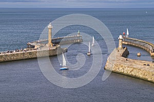 Sailing boats entering the harbour at Whitby