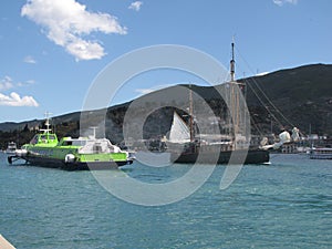 Sailing boats and motor ship on a bay of Poros island in Greece