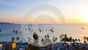 Sailing boats off Boracay island at sunset