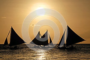Sailing boats on the sea at the sunset at Boracay