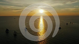 Sailing boats on the sea at the sunset at Boracay island,Philippines. Sailboat against a beautiful sunset.